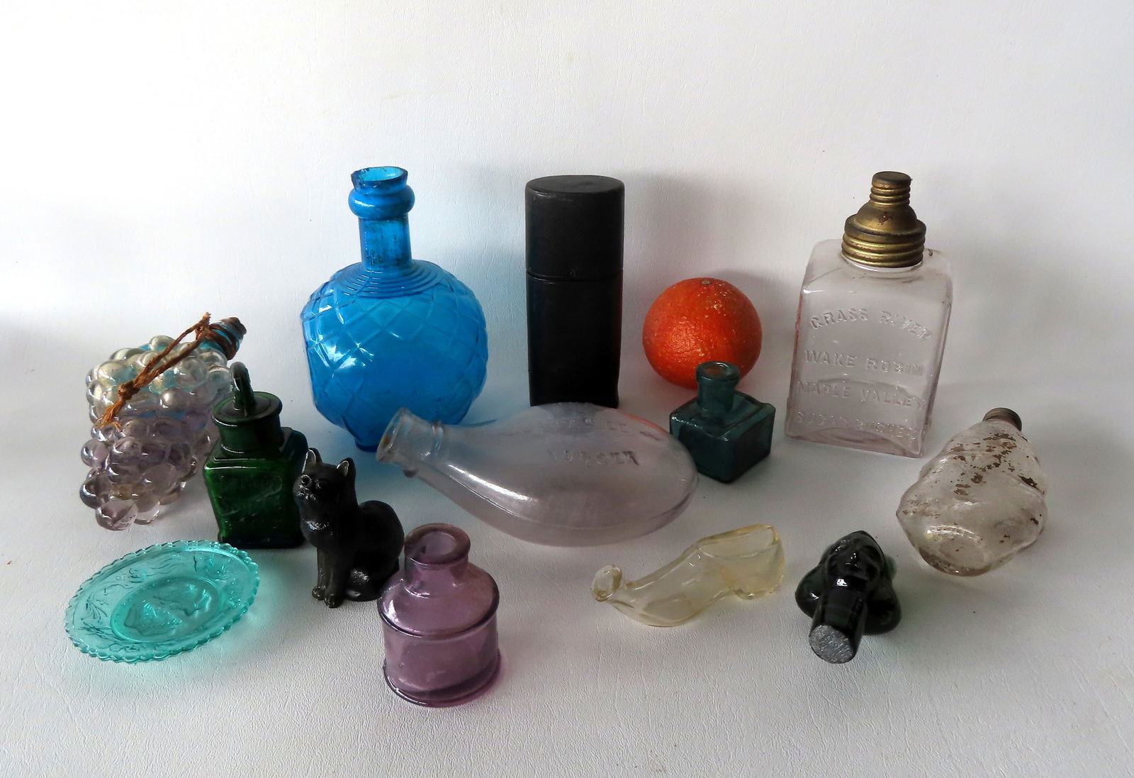 Grouping of 13 glass collectibles including: Blue glass  "Harden's Hand Grenade Fire Extinguisher (1 of 19)