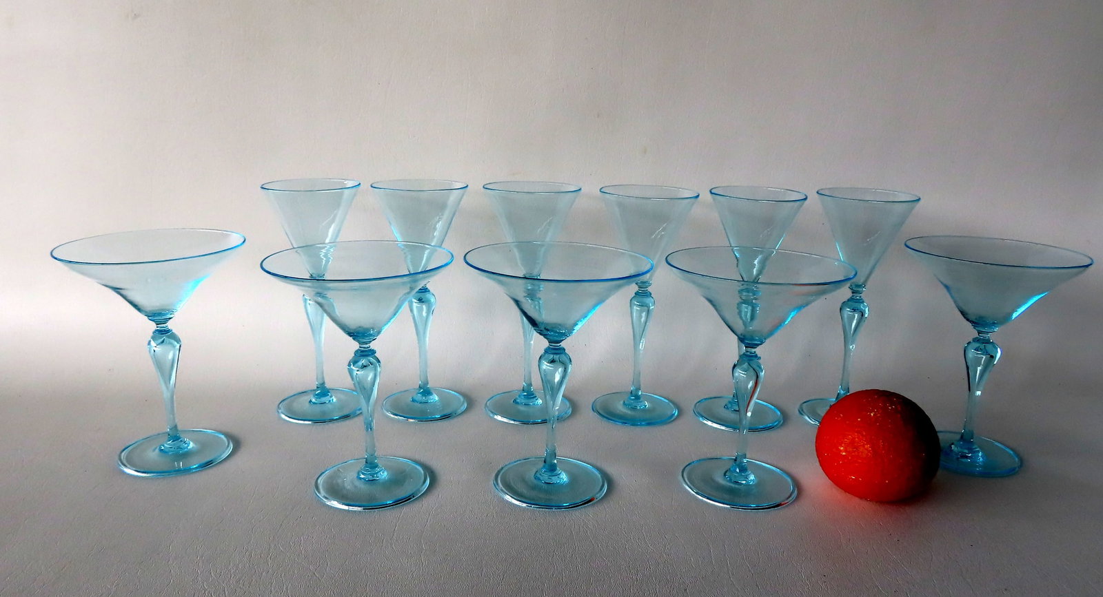 Grouping of 11 pieces of stemware with light blue highlights and bubbles in stem. All without damage: Grouping of 11 pieces of stemware with light blue highlights and bubbles in stem. All without damage and in very good condition. Includes 5 champagne glasses, 6 matching wine glasses. Provenance: From
