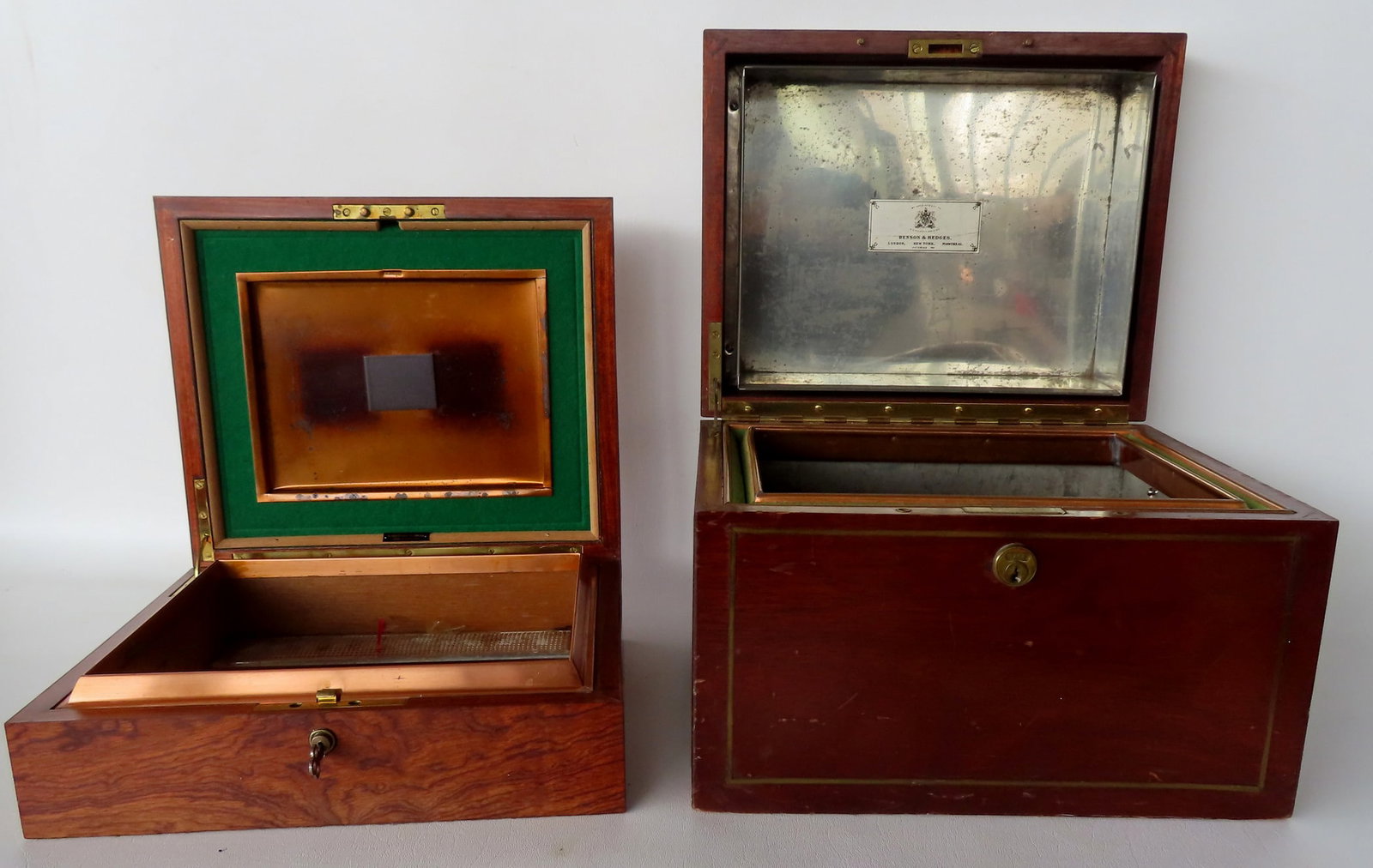 Two very fine humidors. The first in black walnut with brass line inlays - interior tin lined -: Two very fine humidors. The first in black walnut with brass line inlays - interior tin lined - signed Benson & Hedges - very good condition - 12 3/4"W x 10 3/4"D x 9"H; the second in an exotic wood, 