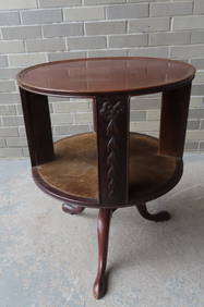 A mahogany drum table with revolving base. Some use wear to top, otherwise good condition. According (1 of 4)