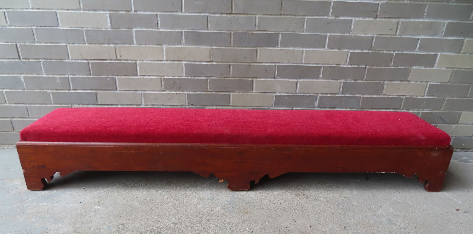 A kneeling bench with a mahogany frame with cutout sides and red upholstered kneeler, circa 1850. (1 of 6)