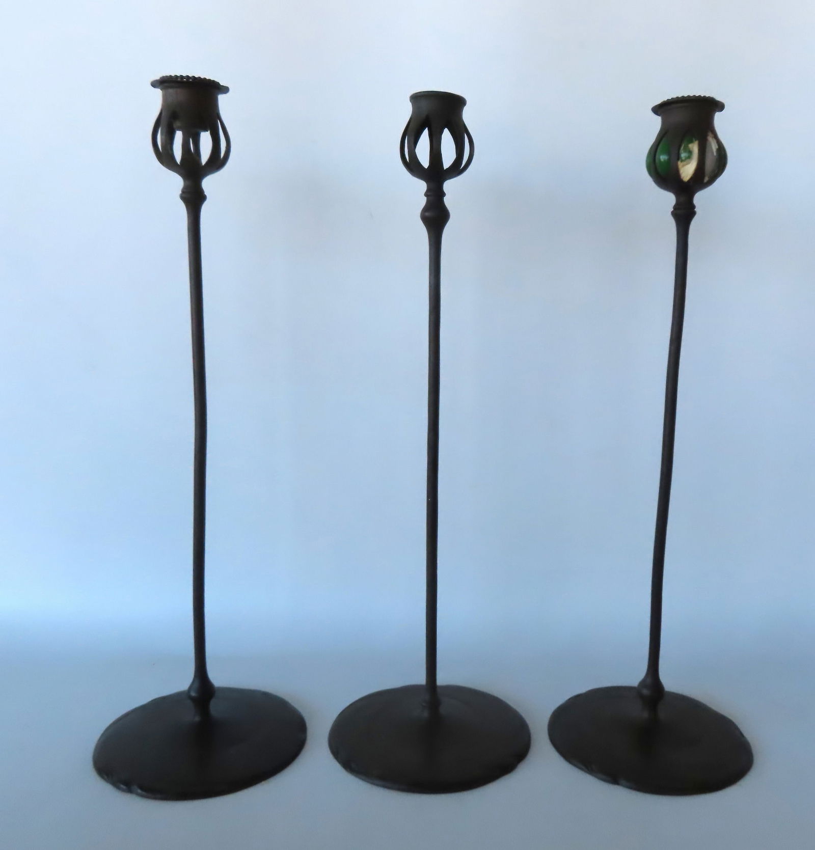 Three matching signed "Tiffany Studios New York" bronze candlesticks . Measures 17 5/8"H x 5 3/4" (1 of 17)