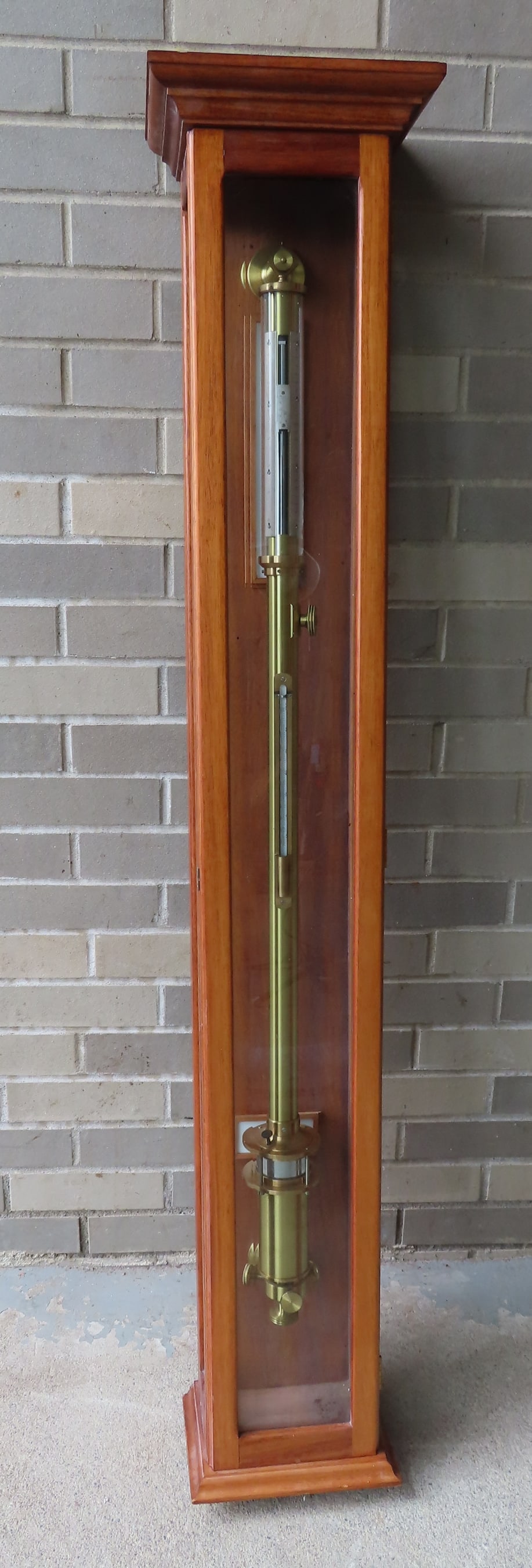 A polished brass ship's stick barometer, late 19th to early 20th century, housed in a modern oak (1 of 13)