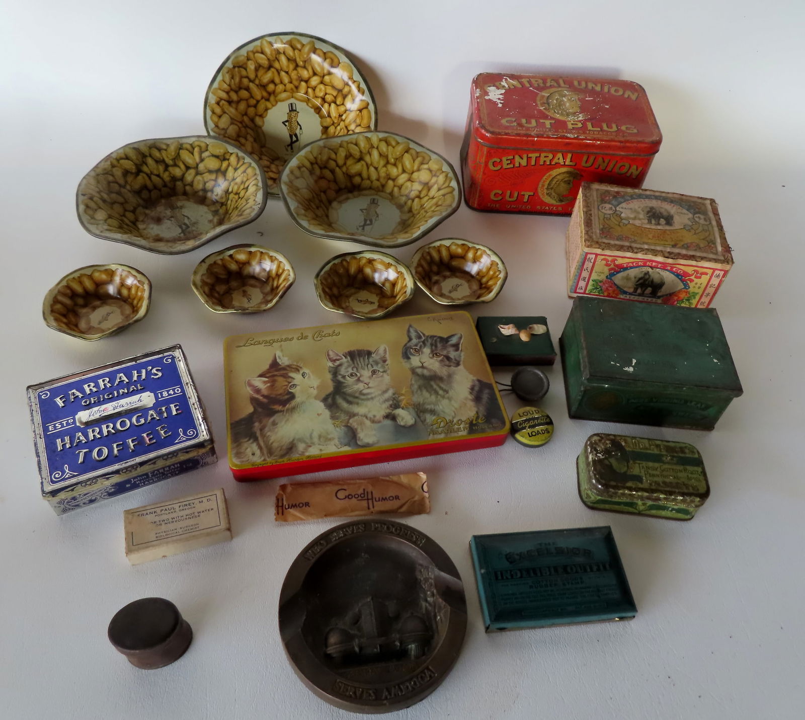 A grouping of advertising tins including: Central Union Cut Plug, Droste Haarlem Holland tin with (1 of 8)