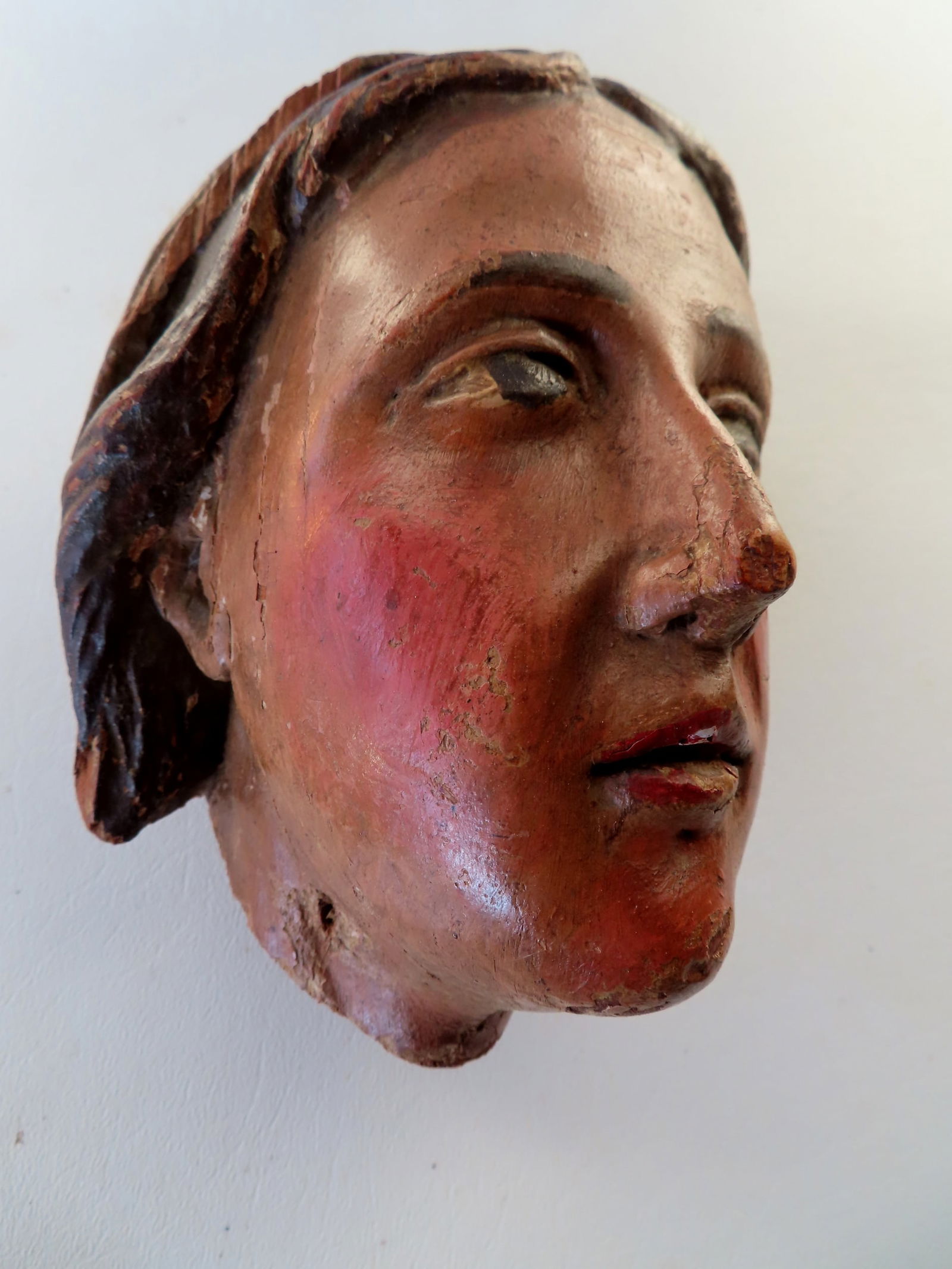 A hand carved wooden polychrome lady's head,  probably part of a ship's figurehead, early 19th (1 of 8)