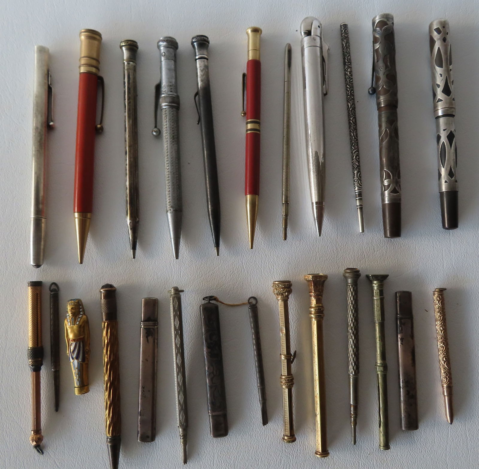 Grouping of 25 pens, mostly lead pens, including: A signed Moore lead pen with brass or gold plated (1 of 5)