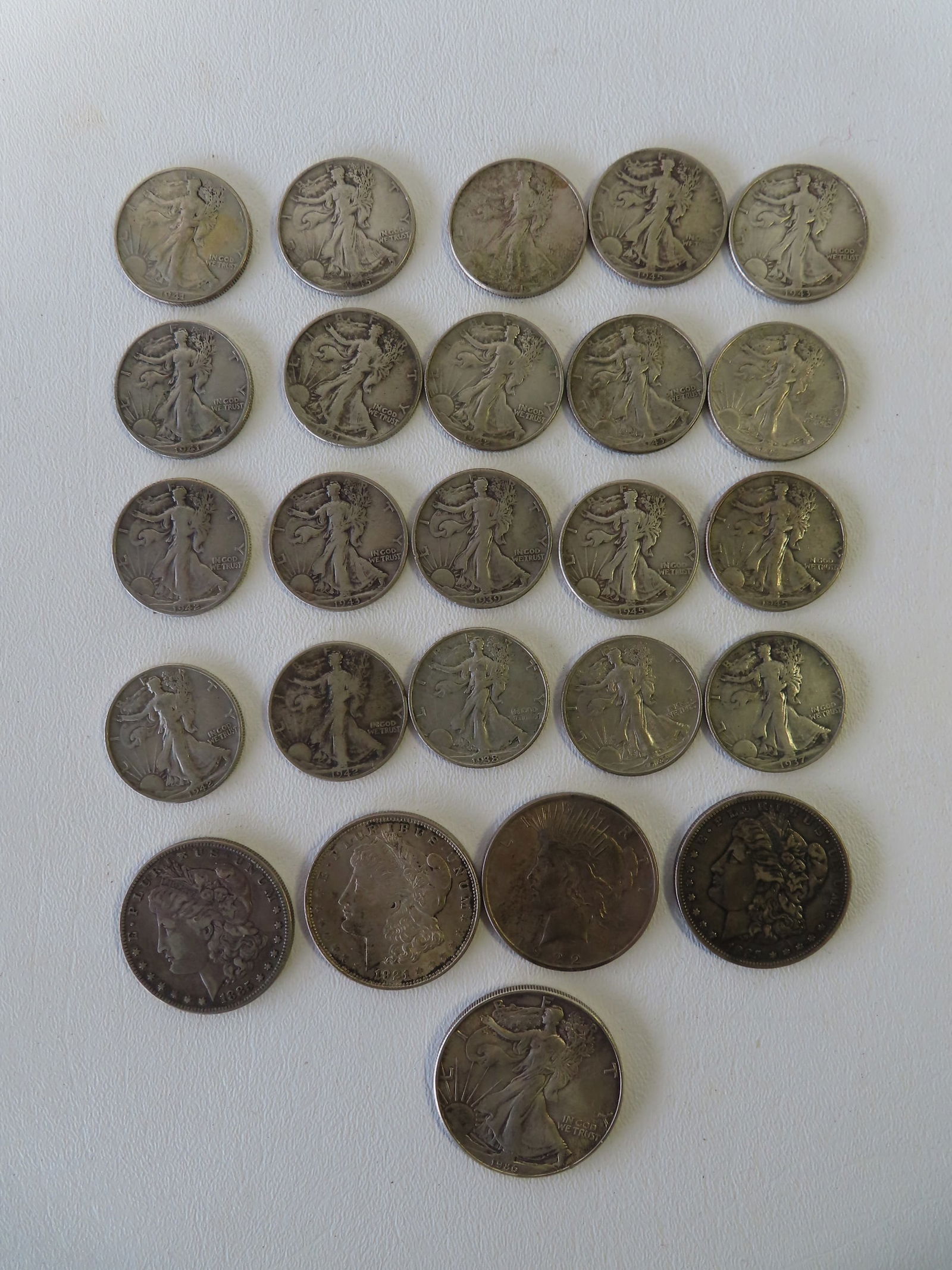 Grouping of silver dollars, and silver half-dollars including: Three Morgan silver dollars - two (1 of 9)