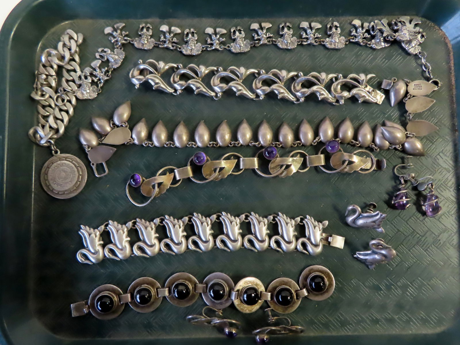 Grouping of 7 pieces of Mexican silver jewelry including: Aztec sterling medallion bracelet signed (1 of 20)