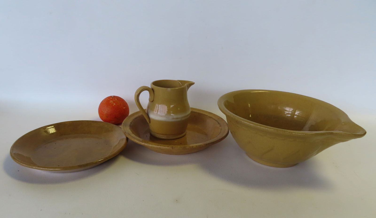 Four pieces of yellowware, 19th century, including batter bowl with embossed sides and rolled rim - (1 of 8)