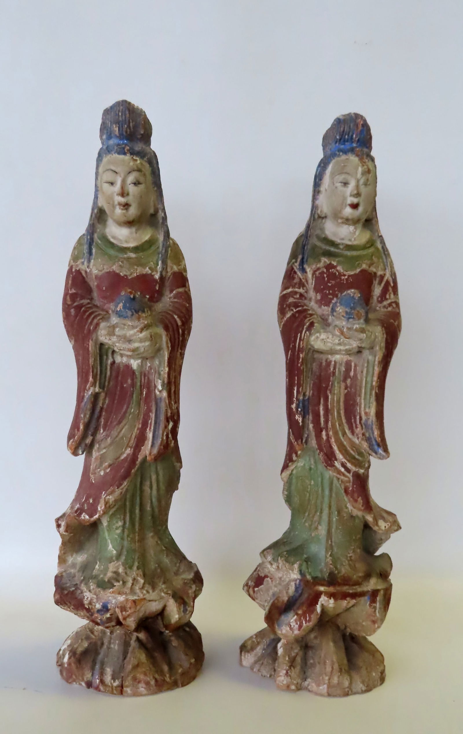 Two polychrome hand carved wooden oriental figures, probably early 20th century - some cracks, worn (1 of 3)