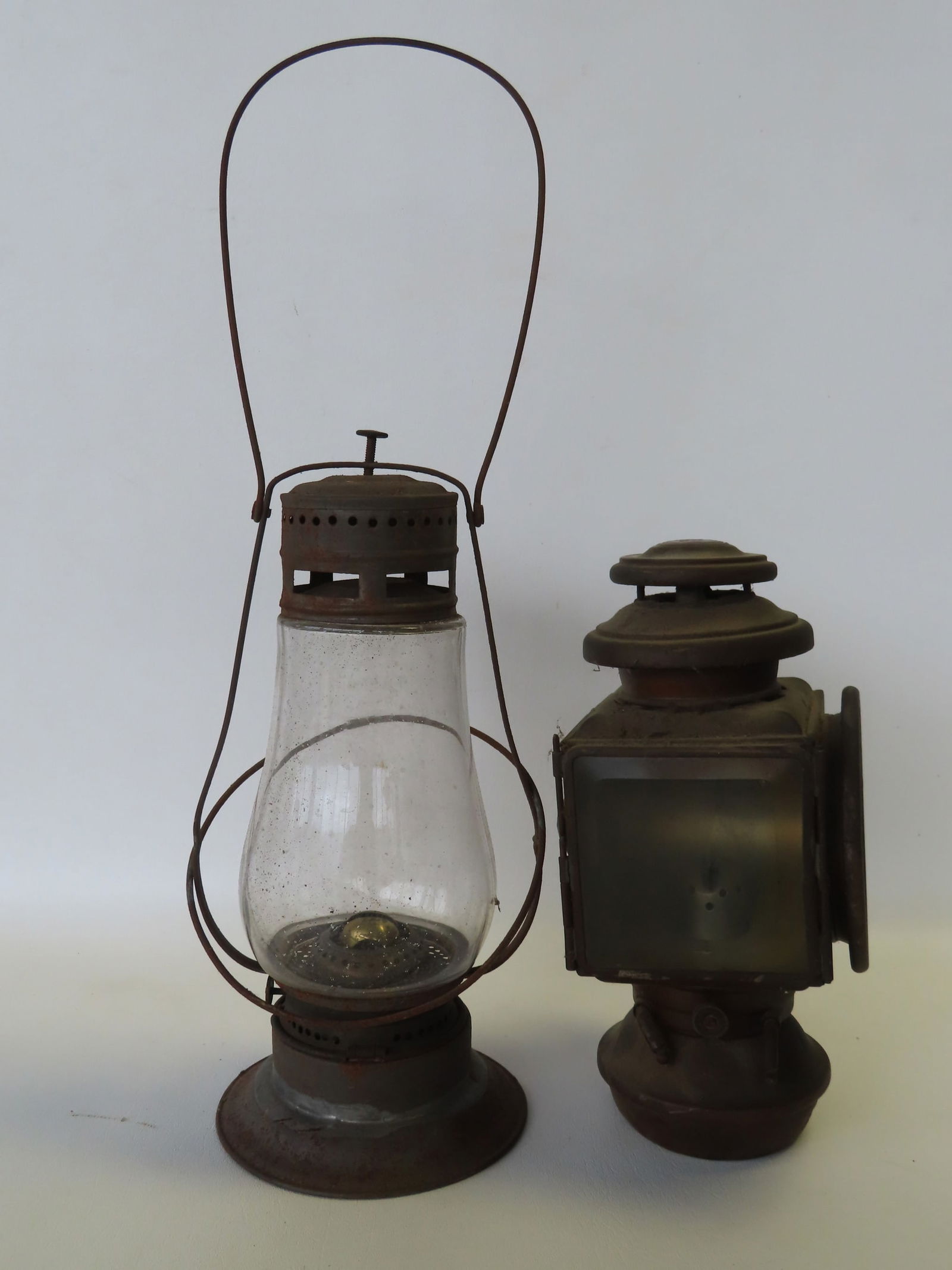 Two early lanterns including: Tin lantern with original glass shade marked  "Dietz Fitall New York (1 of 5)