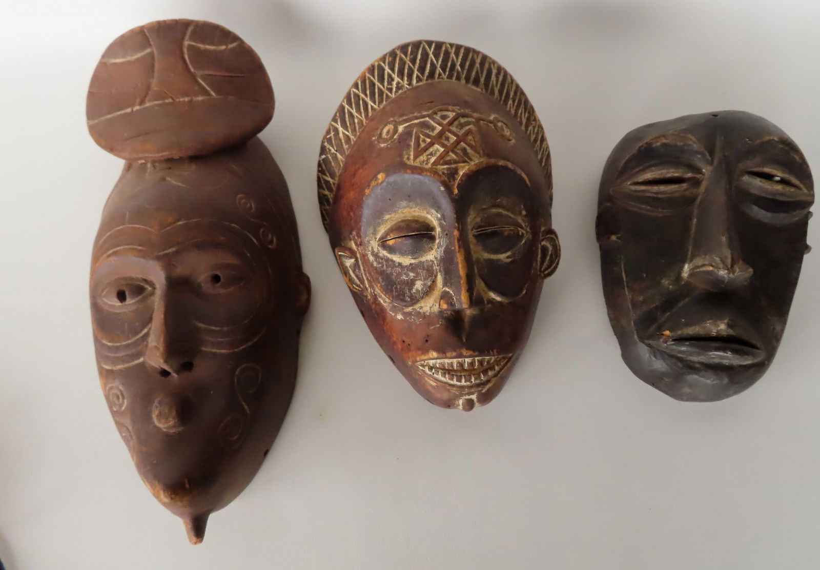 Three African masks, probably 19th century. The largest 17 1/2"H x 8"W. (1 of 8)