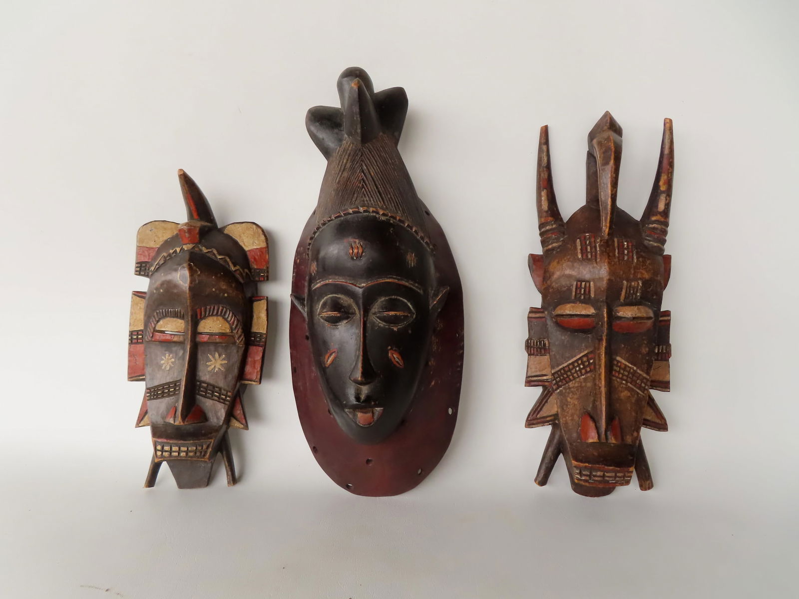 Three African masks, probably 19th century. The largest 13 1/2" x 7"W. (1 of 6)