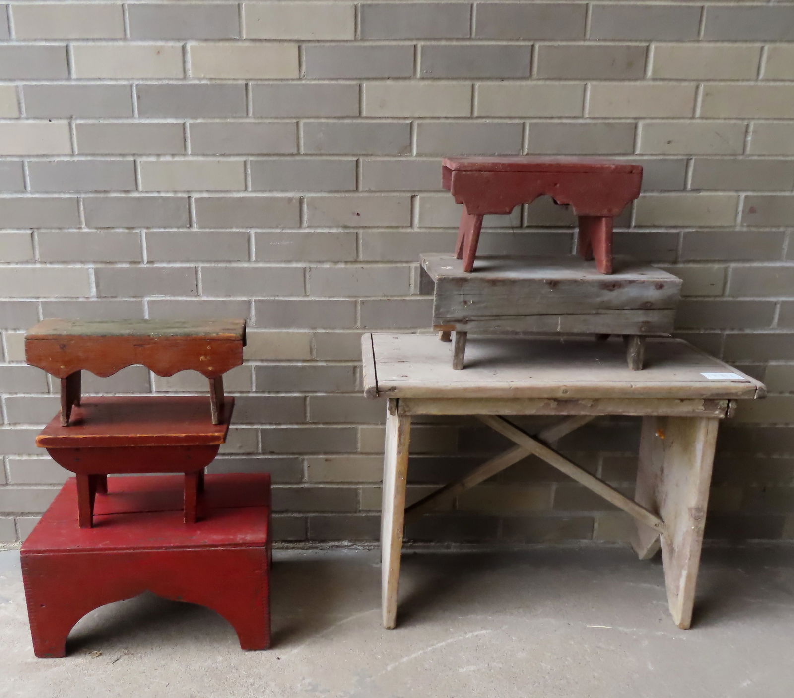 Five primitive cricket stools and one small bench, several in original red paint, most 19th century. (1 of 9)