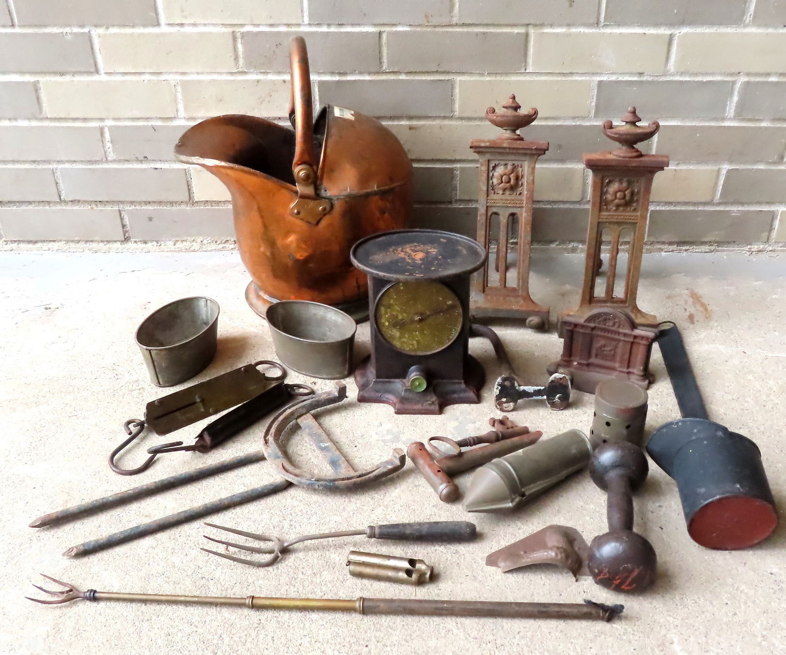 Large lot of country collectibles, most in copper, iron or tin. Includes a heavy English copper coal (1 of 11)