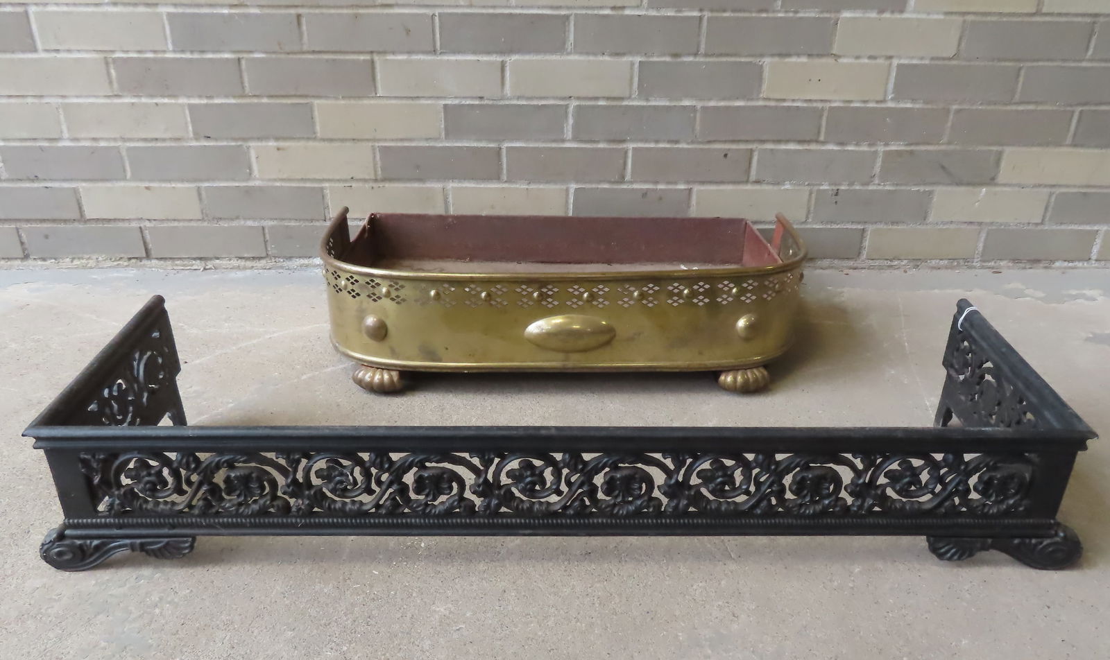 Two fireplace fenders, mid to late 19th century. The first in cast iron - 36"W x 12 1/2"D x 6 1/4"H; (1 of 7)
