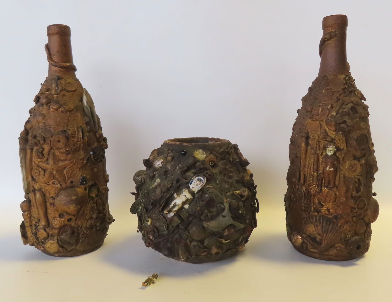 Three folk art memory jugs, likely African American, which was their tradition in preserving the (1 of 20)