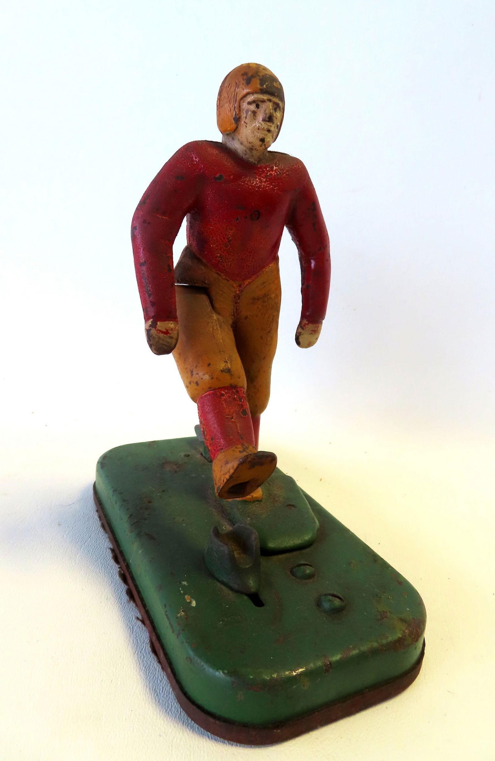 A cast iron mechanical football kicker in original paint - when the lever is pressed the player (1 of 10)