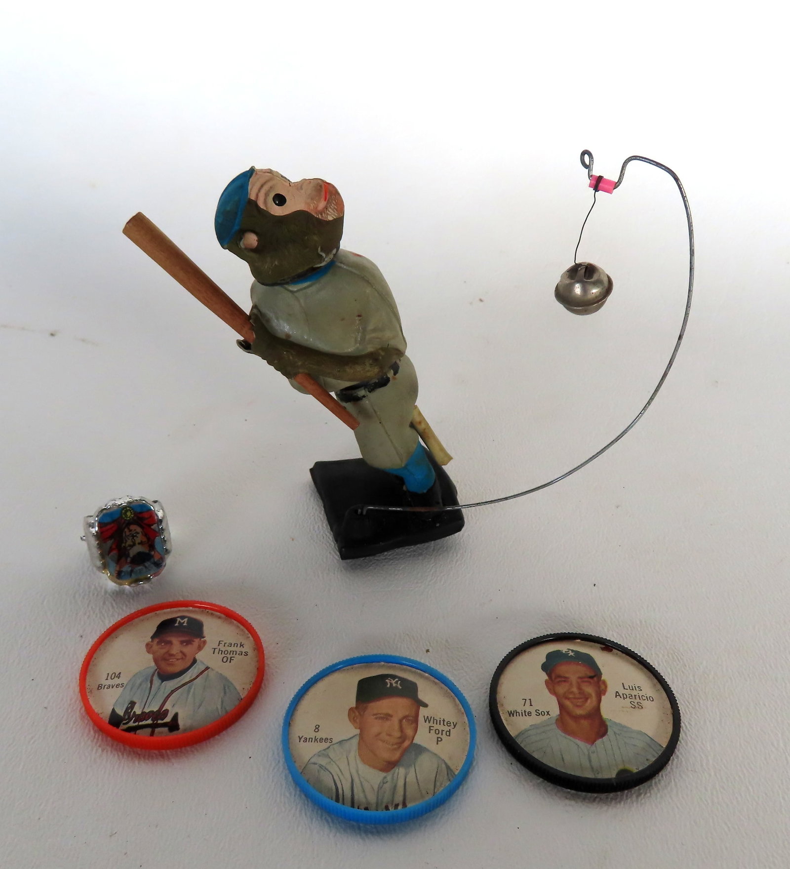 Grouping of mostly baseball collectibles including: An unusual bobble head of monkey with bat wear: Grouping of mostly baseball collectibles including: An unusual bobble head of monkey with bat wear #7 jersey -note the wire projecting from base with attached bell (ball) - turning the post on the rev