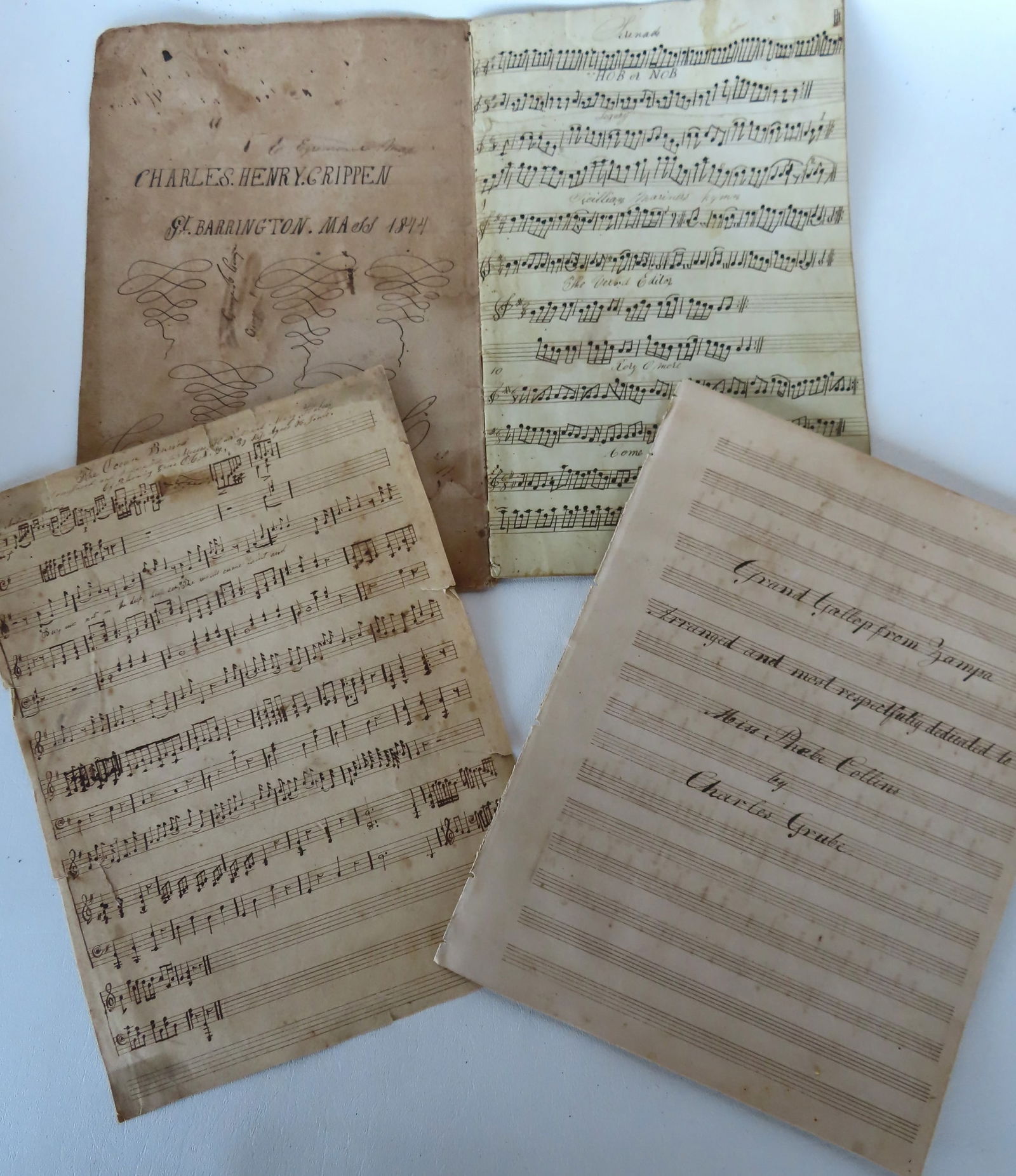 A grouping of  hand written pen and ink pages of musical scores. One in a book signed Charles Henry (1 of 8)