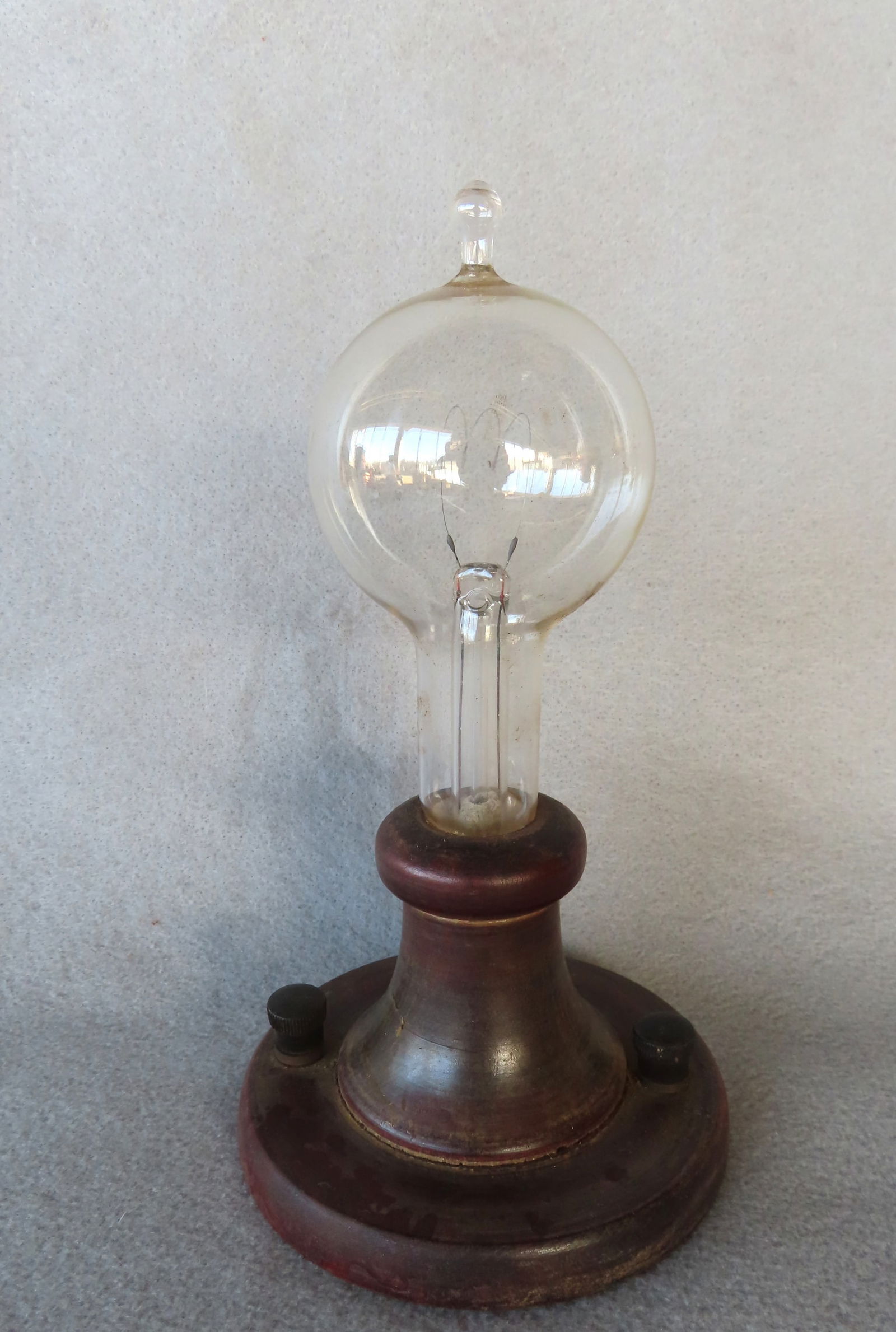 Edison style light bulb built into a turned column attached to a circular wooden  base with small (1 of 3)