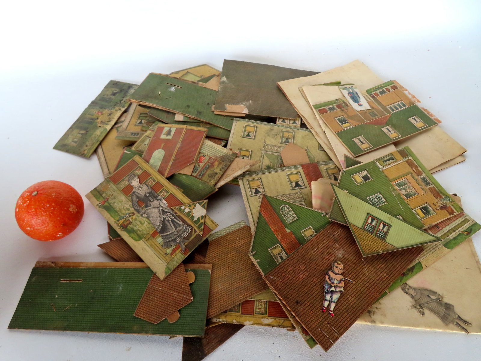 A grouping of original Victorian lithographed cardboard houses - disassembled - asis. (1 of 8)