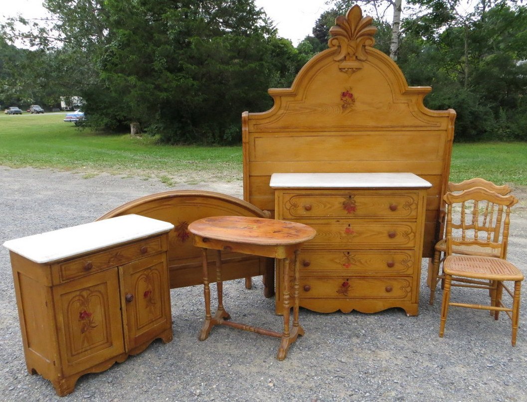 Cottage pine bedroom set - 5 pieces consisting of: Cottage pine bedroom set - 5 pieces consisting of marble top dresser (sides of 2 drawers needs repair), marble top washstand (marble with repair/crack), bedstead, end table & chair. Provenance: From t