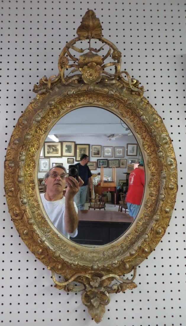 Ornate oval gesso mirror with some losses near top: Ornate oval gesso mirror with some losses near top - 19th century - Overall size 3' H x 1' 9.50"W. Provenance: From the estate of Elaine and Irving Sperber, Southbury Ct.