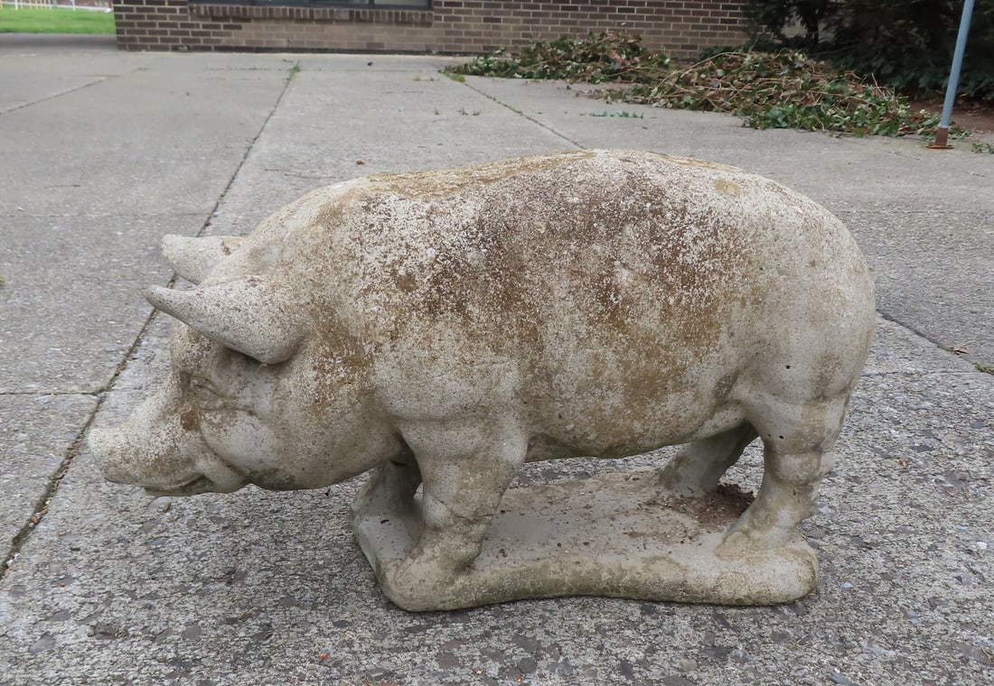 A concrete pig lawn ornament, late 20th century. Crack and small loss to one ear, else good: A concrete pig lawn ornament, late 20th century. Crack and small loss to one ear, else good condition. Measures 26"L x 9 1/2"W x 14"H.