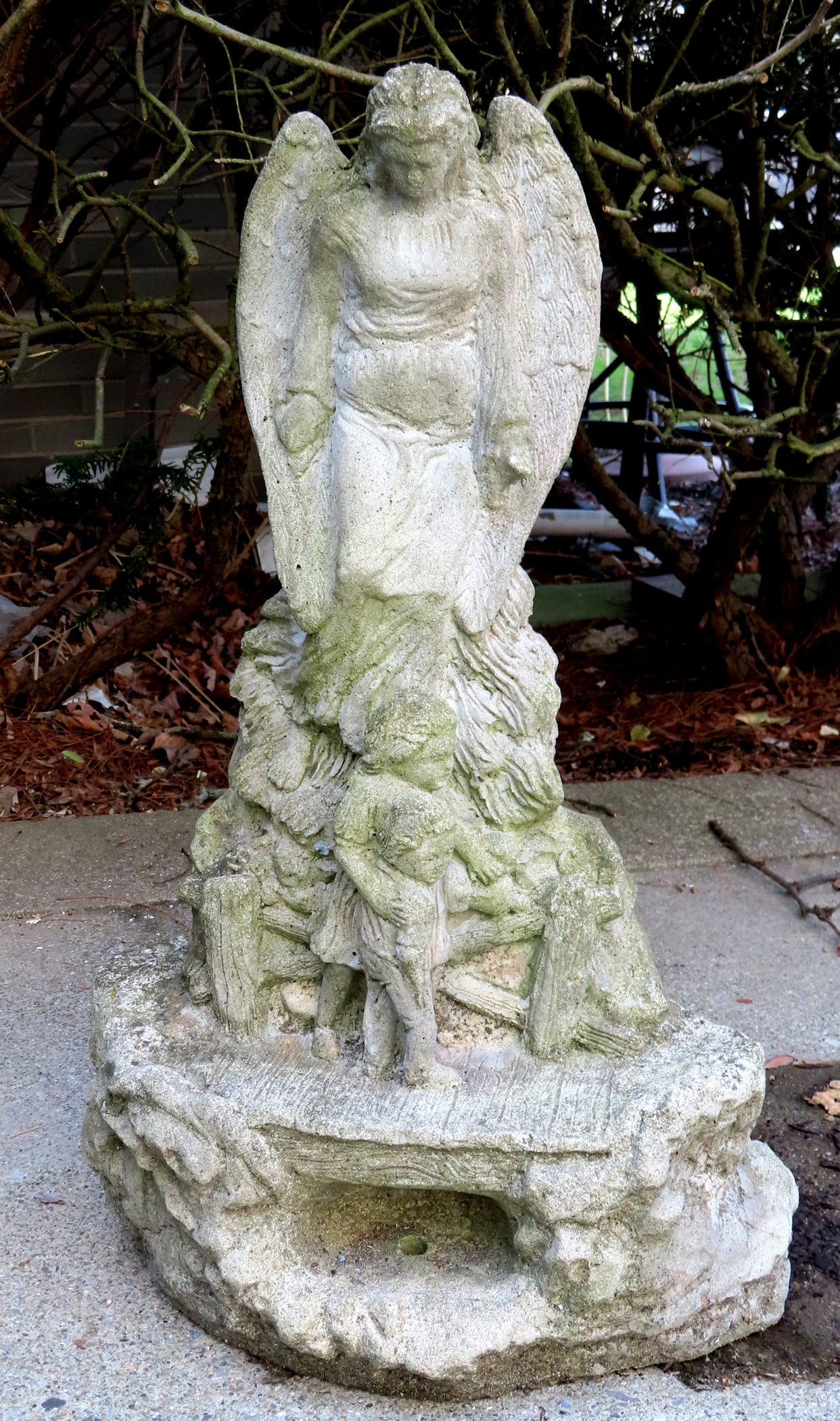 A vintage concrete garden ornament depicting an angel standing on stone wall above 2 children. The: A vintage concrete garden ornament depicting an angel standing on stone wall above 2 children. The base with drilled hole to make it a fountain. Some outdoor use wear, but structurally sound and in go