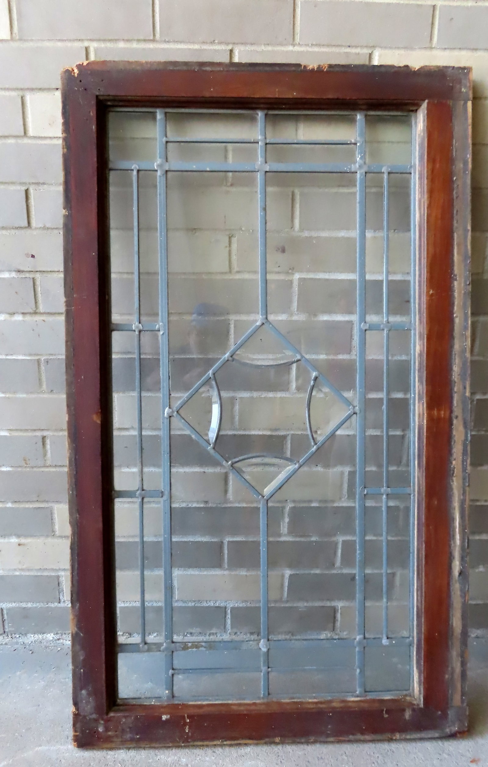 A large leaded glass window, very good condition, late 19th to early 20th century. Measures 23 3/4"W: A large leaded glass window, very good condition, late 19th to early 20th century. Measures 23 3/4"W x 40 1/2"H. Provenance: From a Rochester NY estate, name withheld by family.