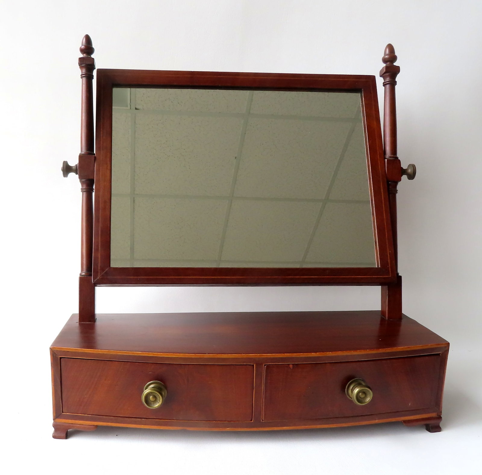 A transitional Chippendale bow front dresser mirror, the mirror posts tilted backwards, line inlay,: A transitional Chippendale bow front dresser mirror, the mirror posts tilted backwards, line inlay, and 2 center dovetailed drawers, mounted on ogee bracket base, probably late 18th to early 19th cent