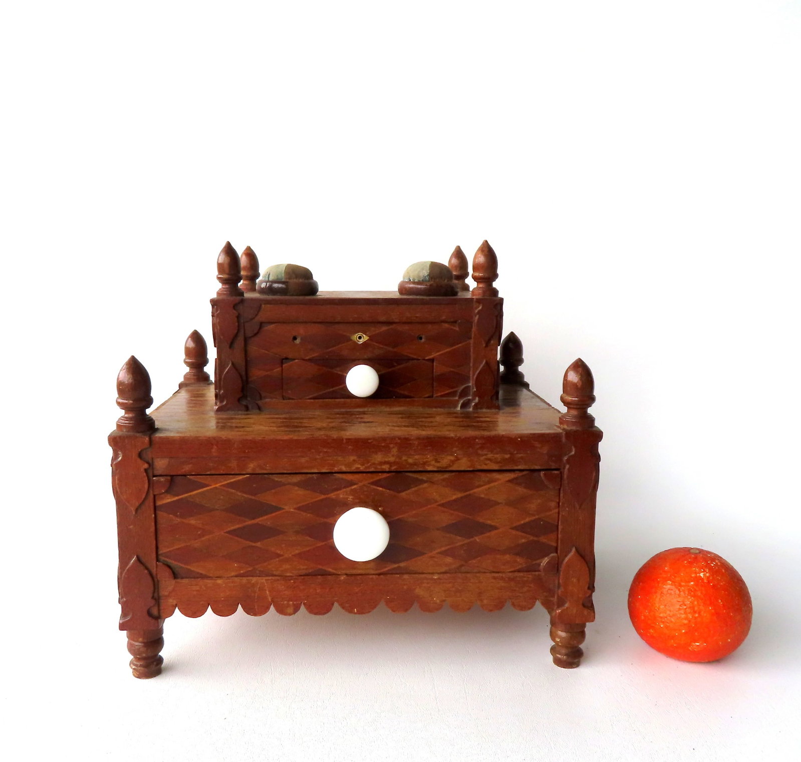 A very fine folk art sewing box with a stepped back, with removable lid with 2 pincushions and acorn: A very fine folk art sewing box with a stepped back, with removable lid with 2 pincushions and acorn finials and single drawer, over lift top that exposes interior compartment with drawer, 2 pincushio