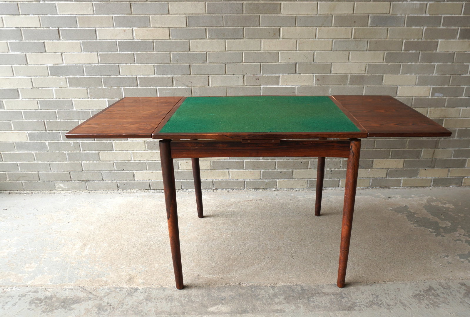 Poul Hundevad rosewood game table, Danish Modern design, with 2 pull-out leaves and reversible: Poul Hundevad rosewood game table, Danish Modern design, with 2 pull-out leaves and reversible rosewood and felt top that converts from a small table that seats 4, to a larger table that would comfort