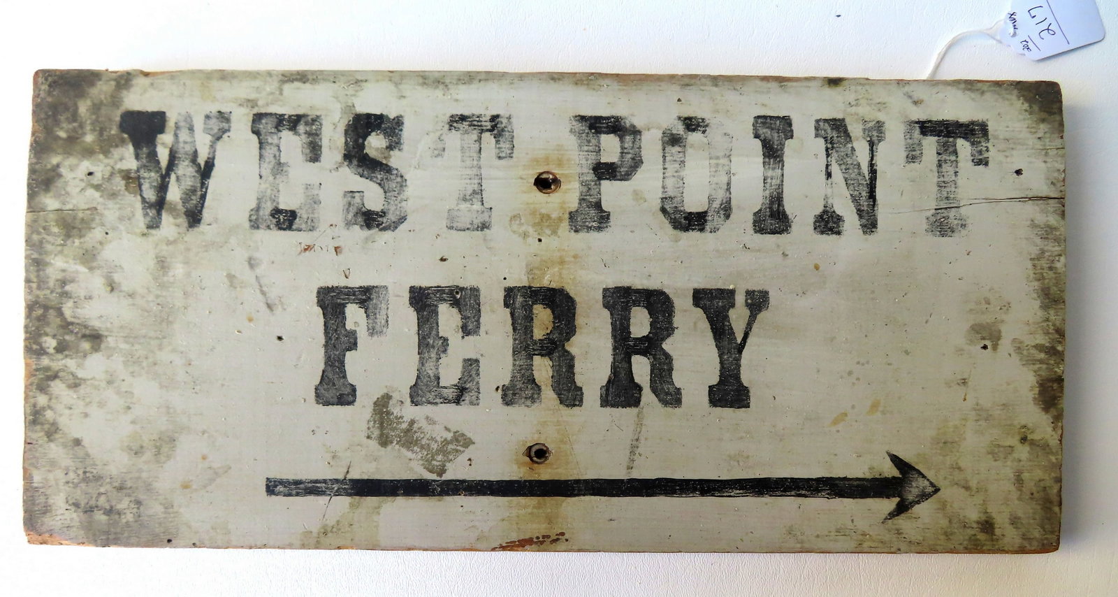 A rare vintage local ferry boat wooden sign marked "WEST POINT FERRY" with directional arrow, in: A rare vintage local ferry boat wooden sign marked "WEST POINT FERRY" with directional arrow, in original black stenciled lettering on white ground. Some wear, but overall very good condition. Measure