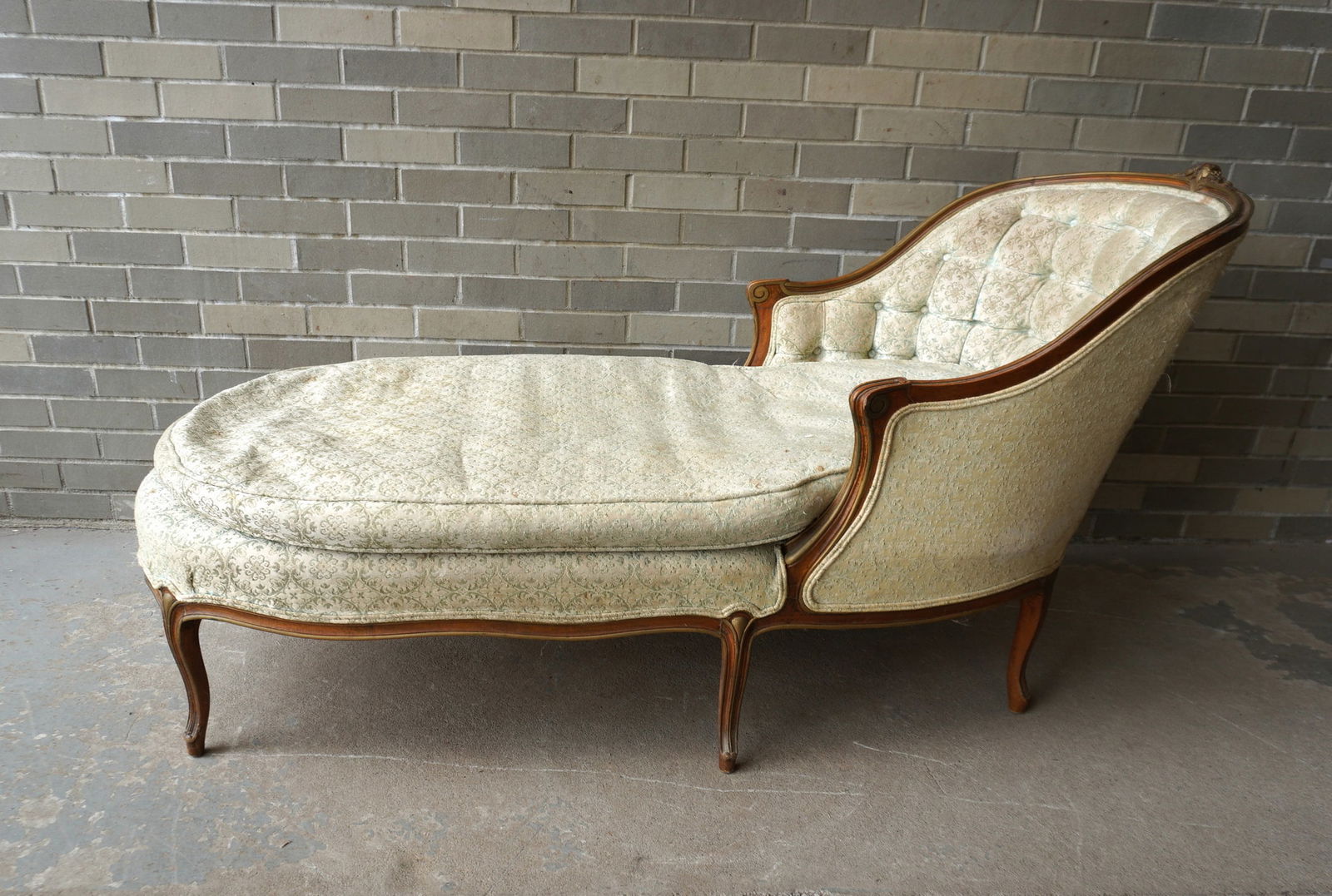 A French chaise lounge with carved wooden frame, down filled and mounted on cabriole legs, 19th: A French chaise lounge with carved wooden frame, down filled and mounted on cabriole legs, 19th century. The fabric with fabric pulls, stains and use wear - the frame in very good stable condition. Me