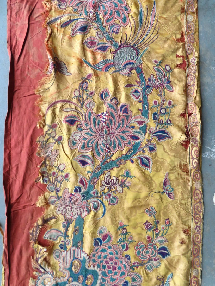 An embroidered silk, oriental pattern, lined curtain panel decorated with exotic birds, butterflies,: An embroidered silk, oriental pattern, lined curtain panel decorated with exotic birds, butterflies, and flowers. Some losses to silk, see photos. Measures 9' 9"L x 2' 3". Probably late 18th century.