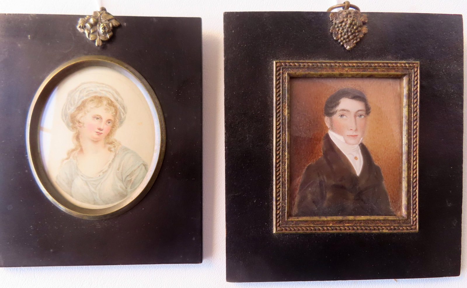 Two miniature W/C Portraits, both early 19th century. The first of a young man - original paper: Two miniature W/C Portraits, both early 19th century. The first of a young man - original paper backing attached to reverse identifying sitter in old script (illegible) and also signed Manchester 1823