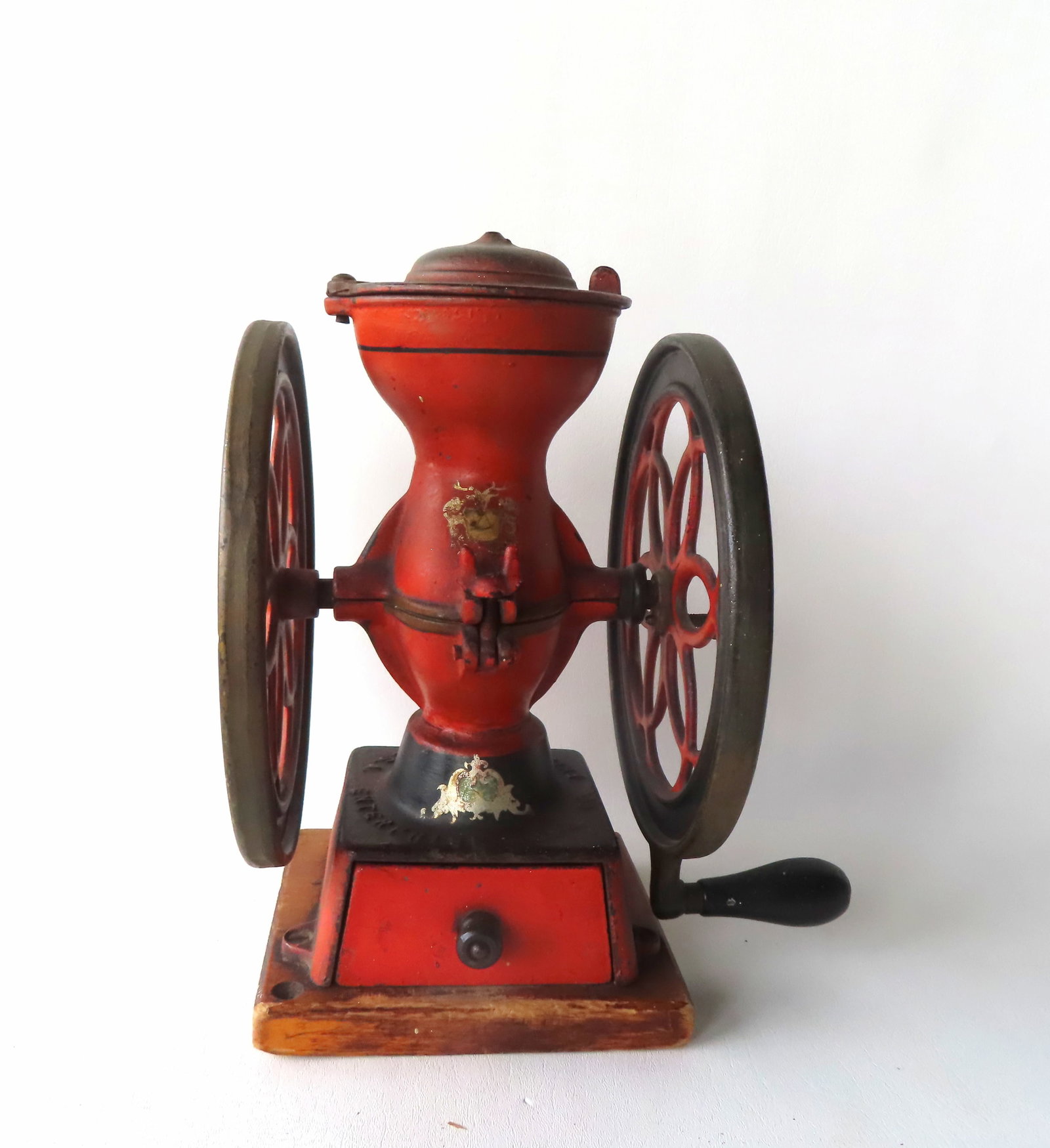 A small Enterprise double wheel coffee grinder in original paint having its original stenciling and: A small Enterprise double wheel coffee grinder in original paint having its original stenciling and original cast iron drawer - very good condition. Measures 12 1/2"H x 11"W x 8 1/2"W (diameter of whe