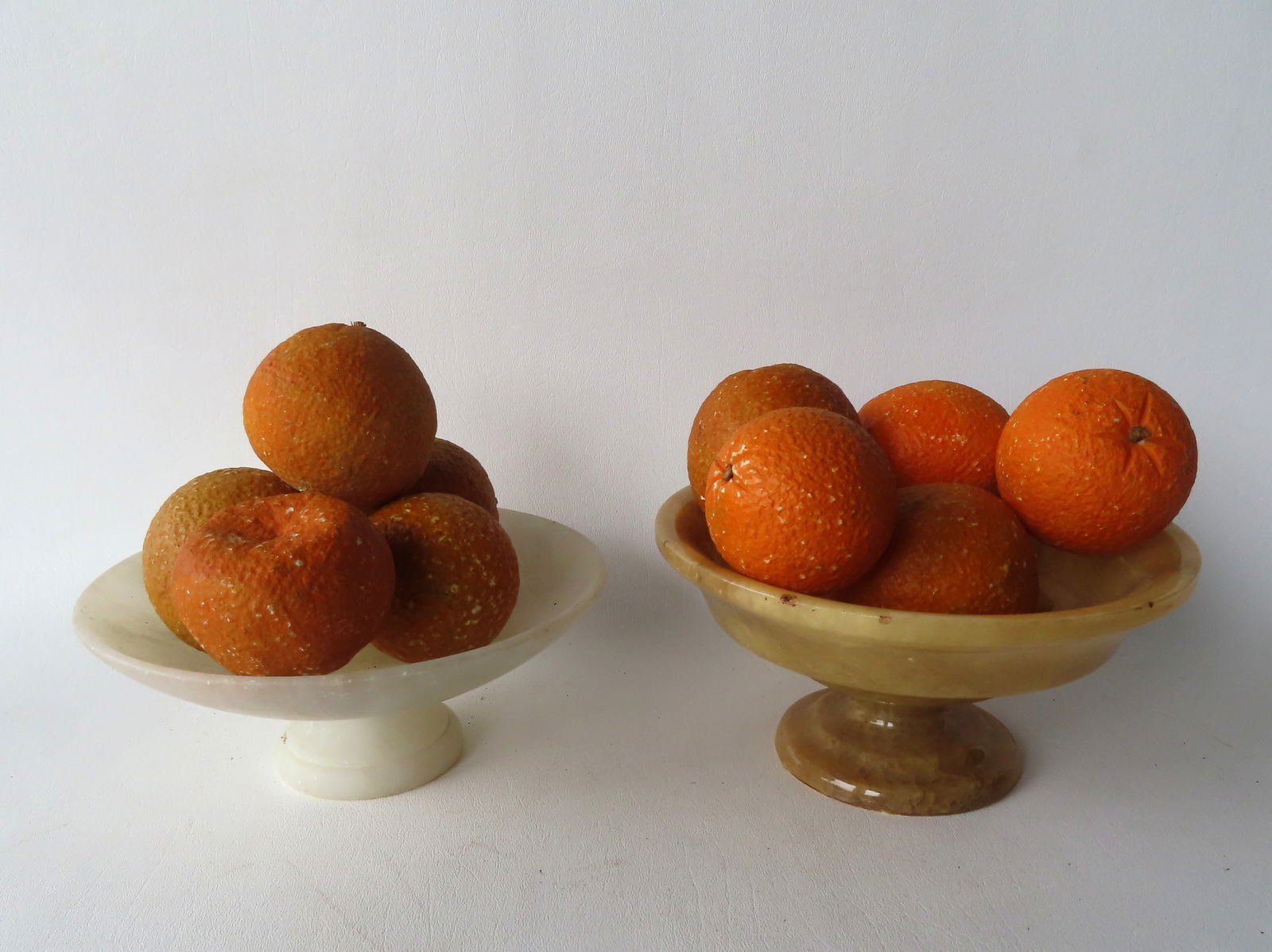 Grouping of 10 pieces of vintage stone fruit and 2 alabaster bowls. The largest bowl measures 8": Grouping of 10 pieces of vintage stone fruit and 2 alabaster bowls. The largest bowl measures 8" diameter x 4"H. All in good condition.