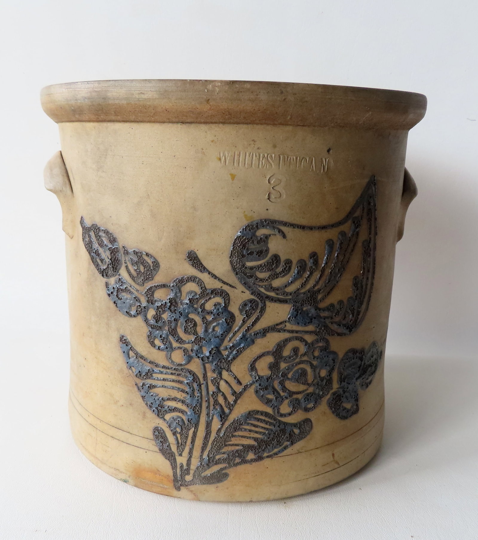 Stoneware crock impressed "WHITES UTICA NY", 3 gallon, decorated with a large cobalt blue flower -: Stoneware crock impressed "WHITES UTICA NY", 3 gallon, decorated with a large cobalt blue flower - some losses to the cobalt blue, and a small chip on the interior edge of rim, else good condition. Me