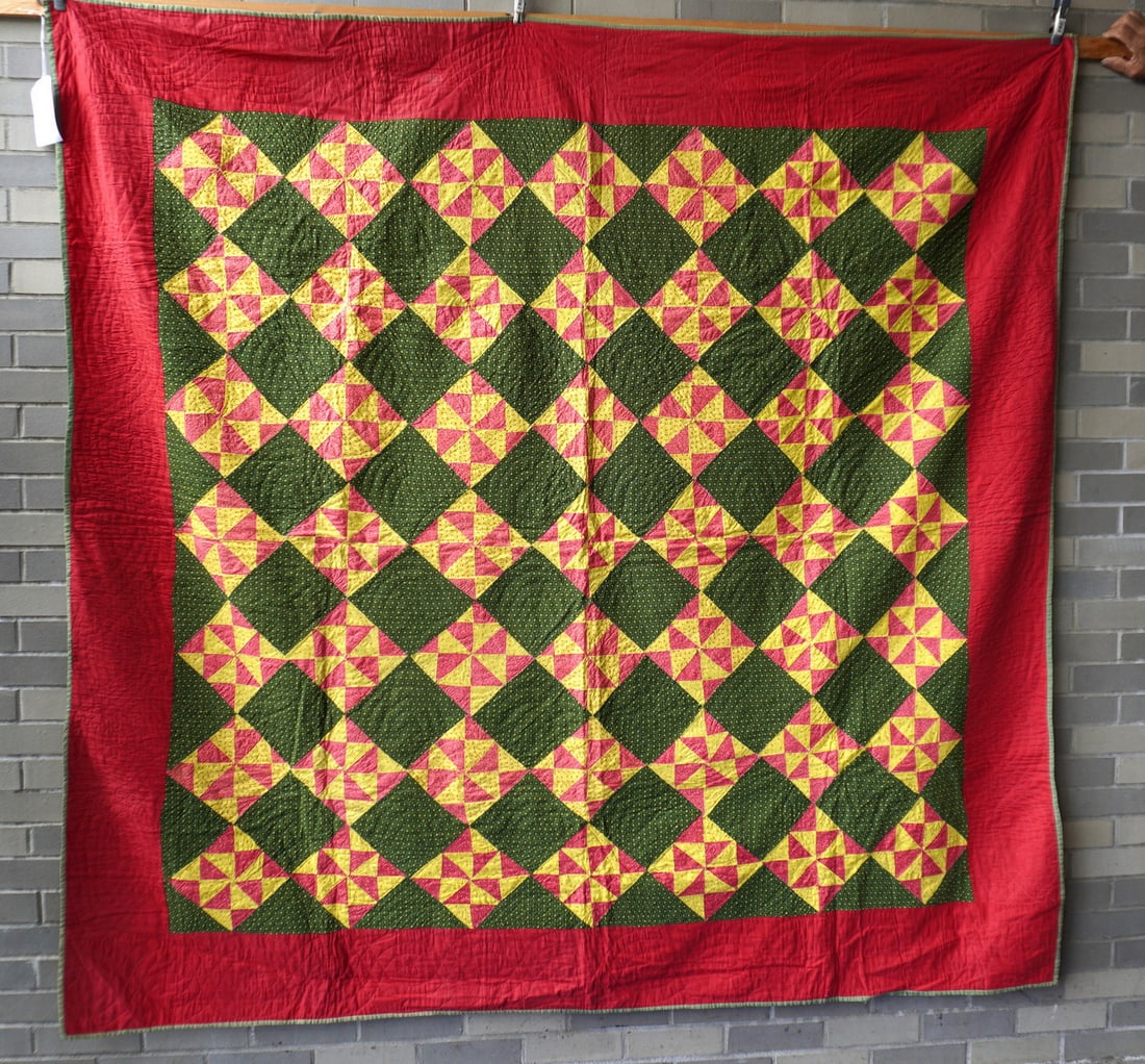 Pennsylvania patchwork quilt in a pinwheel pattern, all hand sewn with quilted red boarder, late: Pennsylvania patchwork quilt in a pinwheel pattern, all hand sewn with quilted red boarder, late 19th to early 20th century in very good condition. Measures 76" x 79".