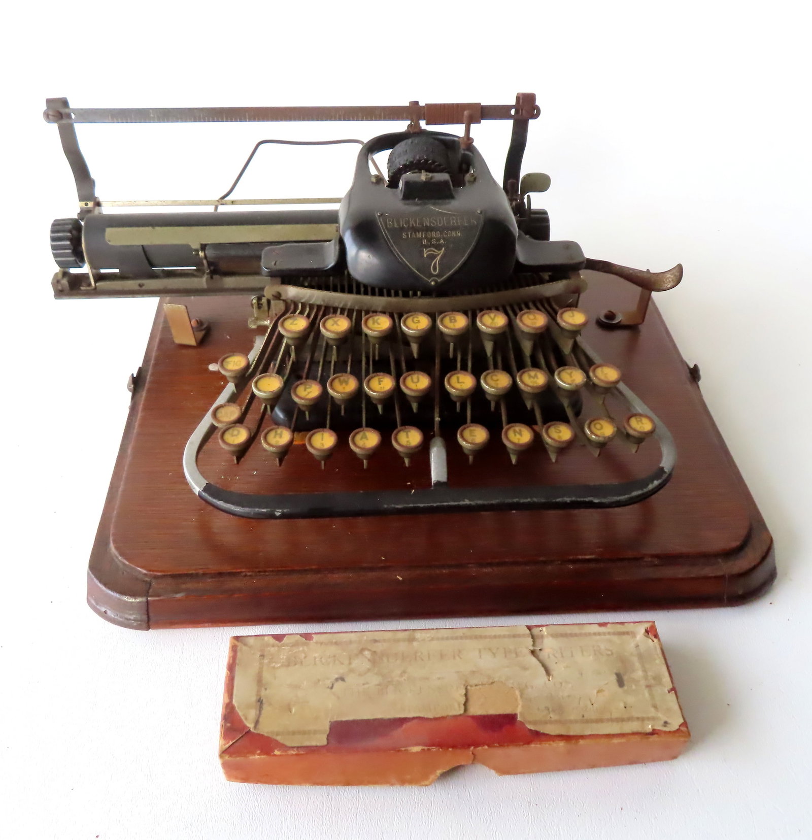 A Blickensderfer No. 7 typewriter made in Stamford Ct. Two typing balls including regular font and a: A Blickensderfer No. 7 typewriter made in Stamford Ct. Two typing balls including regular font and a script font. The typewrite is complete but missing top part of case - Carriage does not move so nee