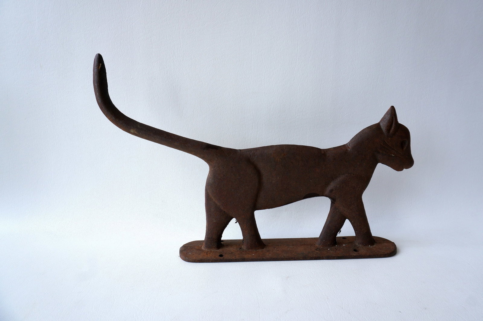 A cast iron boot scraper in the form of a cat with long tail -16 1/2"L x 10 3/4"H - very good: A cast iron boot scraper in the form of a cat with long tail -16 1/2"L x 10 3/4"H - very good condition, early 20th century.