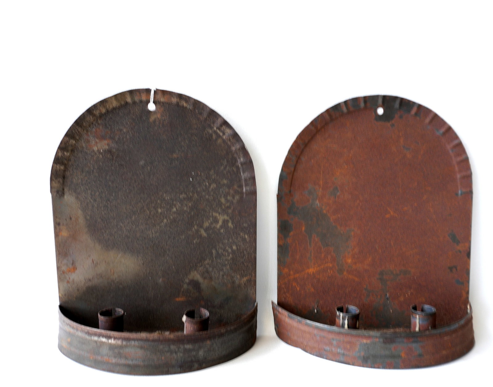 A matched pair of double candle wall sconces with crimped domed tops - some surface rust but overall: A matched pair of double candle wall sconces with crimped domed tops - some surface rust but overall good condition. Hand made, probably late 19th to mid 20th century. Each measures 10 3/4" x 9". Prov