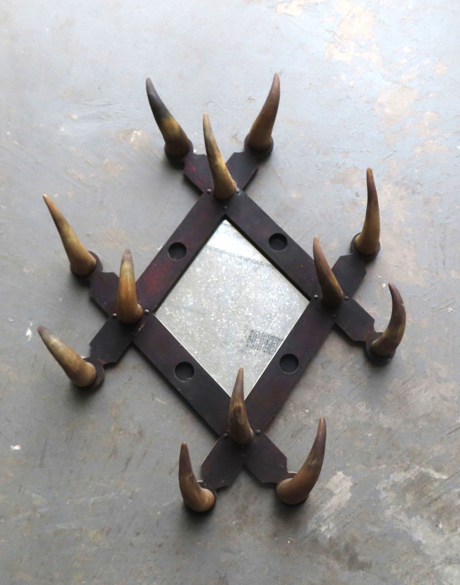 A rustic folk art hall mirror / hat rack with attached animal horns for holding hats, late 19th: A rustic folk art hall mirror / hat rack with attached animal horns for holding hats, late 19th century in good original condition.