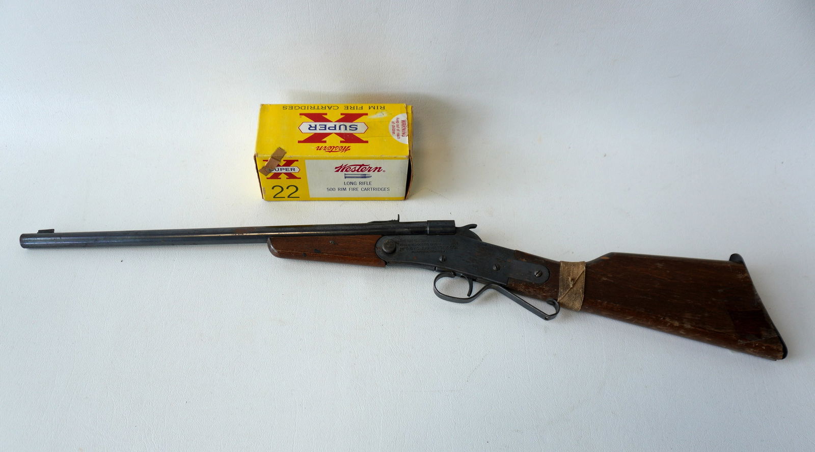 A child's single shot 22 cal rifle signed "The Hamilton Rifle No. 27/22 cal." - last patent date: A child's single shot 22 cal rifle signed "The Hamilton Rifle No. 27/22 cal." - last patent date 1917 - surface rust and repair to stock, but working condition - this is the largest item in this lot m