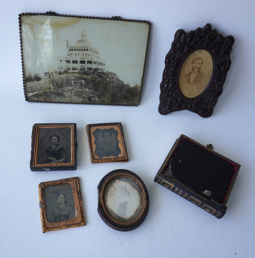Grouping of mostly cased photos including: 1 Daguerreotype; several ambrotypes; a CDV housed within: Grouping of mostly cased photos including: 1 Daguerreotype; several ambrotypes; a CDV housed within a gutta percha frame decorated with oak leaves and nuts, marked on reverse "Patent 1868 / Diatite / 