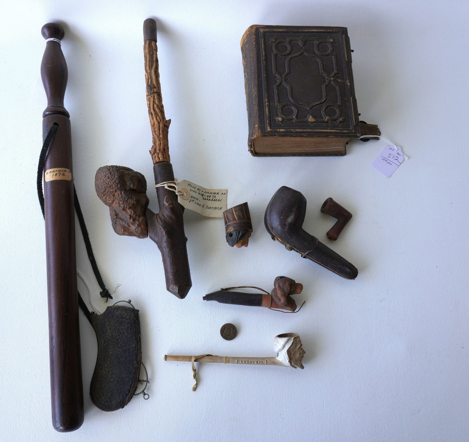 A grouping of mostly Civil War era articles including a CDV album with family photos (no soldiers);: A grouping of mostly Civil War era articles including a CDV album with family photos (no soldiers); a clay pipe signed illegibly and also marked France, having a hand painted bowl in the form of a bea