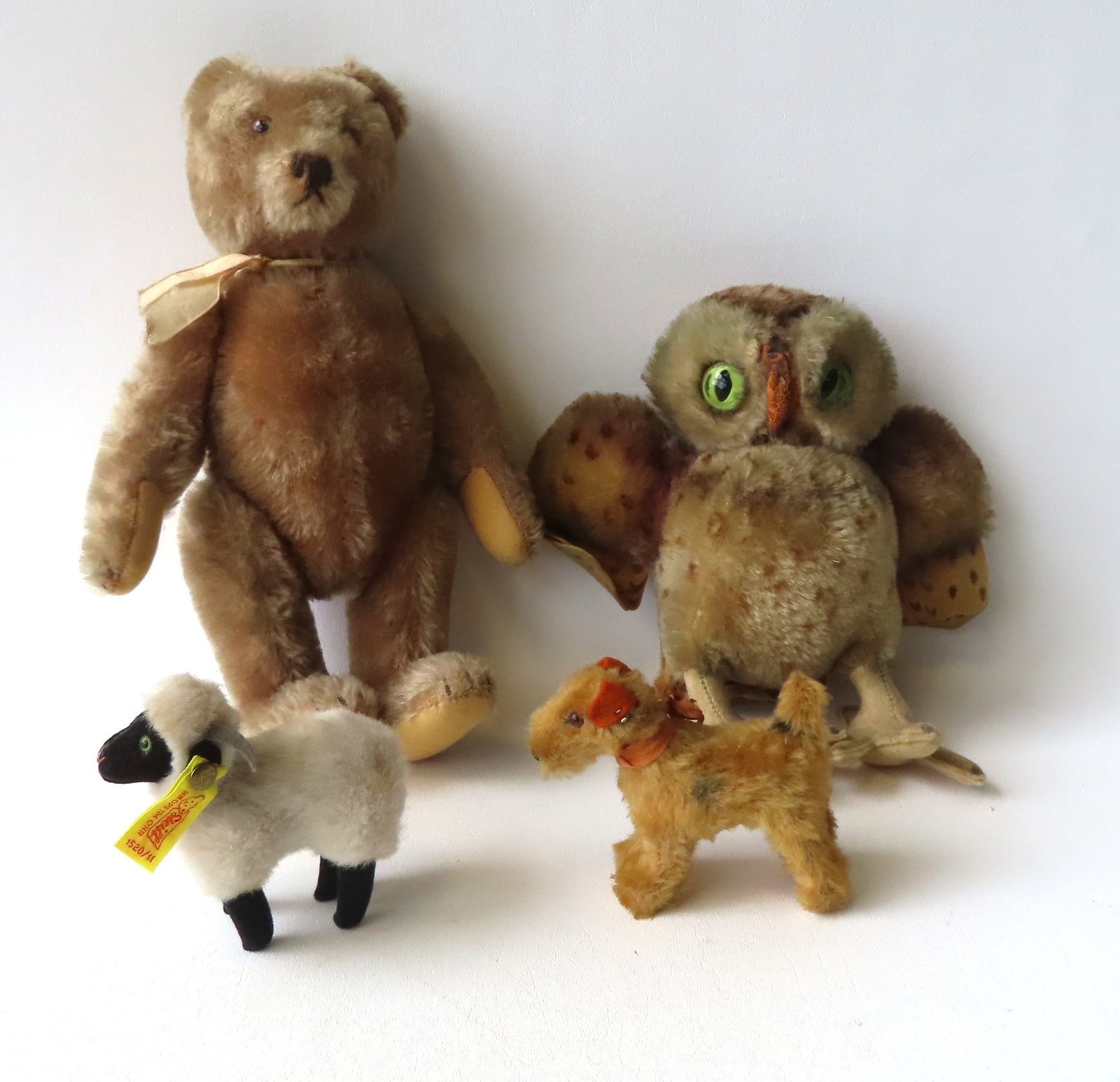 Grouping of 4 Steiff animals, circa 1950-80, including: A jointed hump-back Teddy Bear with long: Grouping of 4 Steiff animals, circa 1950-80, including: A jointed hump-back Teddy Bear with long snout, glass eyes, and growler - (the growler works best when the bear is facing forward - moving the b